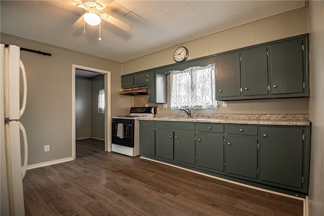 kitchen featuring sink, dark wood-type flooring, white appliances, and ceiling fan