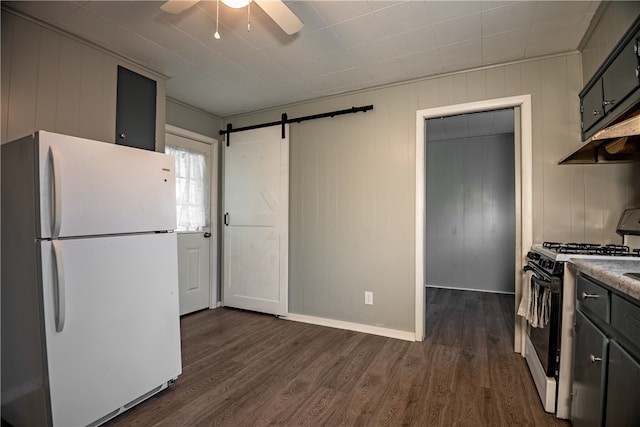 kitchen featuring gray cabinetry, dark hardwood / wood-style floors, a barn door, and white appliances