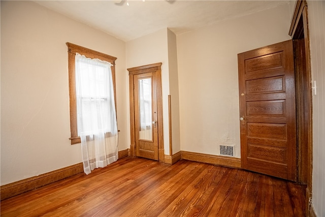 unfurnished room with light hardwood / wood-style flooring