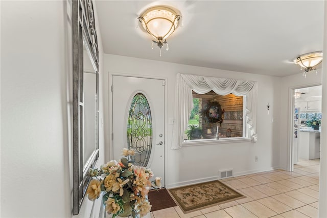 foyer featuring light tile patterned floors