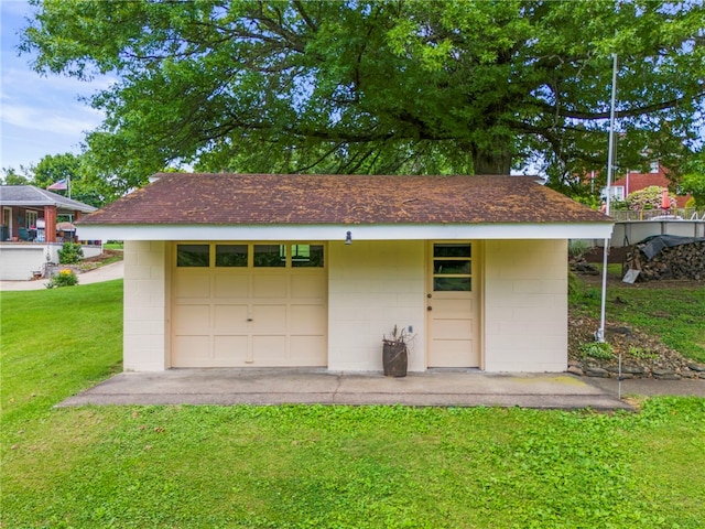 garage with a yard