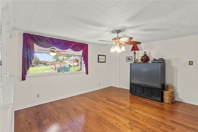 unfurnished living room featuring wood-type flooring and ceiling fan