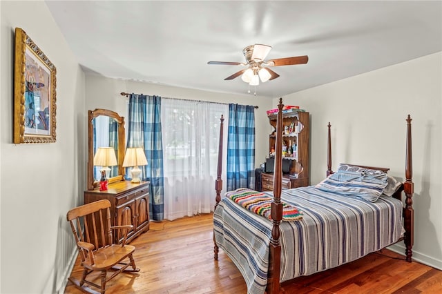 bedroom featuring hardwood / wood-style floors and ceiling fan