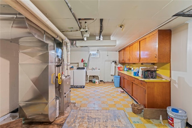 basement with washer / clothes dryer and sink