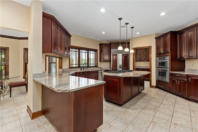 kitchen featuring a kitchen island, hanging light fixtures, kitchen peninsula, stainless steel appliances, and sink