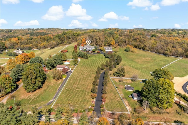 birds eye view of property with a rural view