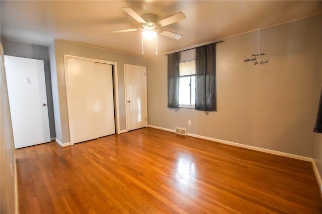 unfurnished bedroom featuring ceiling fan and wood-type flooring