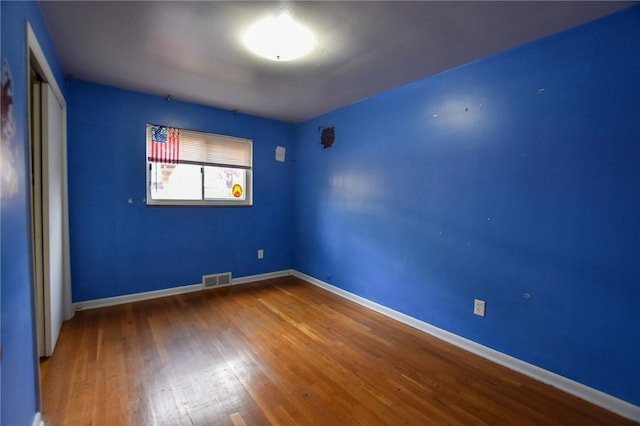 empty room featuring hardwood / wood-style floors