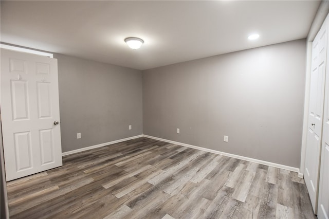 unfurnished bedroom with hardwood / wood-style floors and a closet