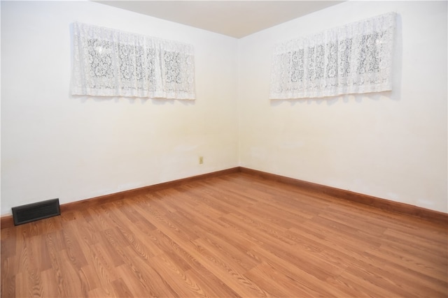 empty room with wood-type flooring