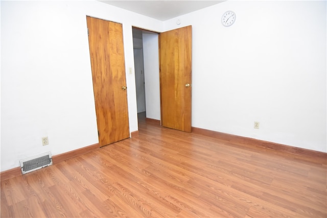 empty room with light wood-type flooring