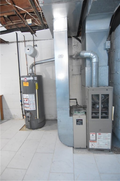 utility room featuring gas water heater