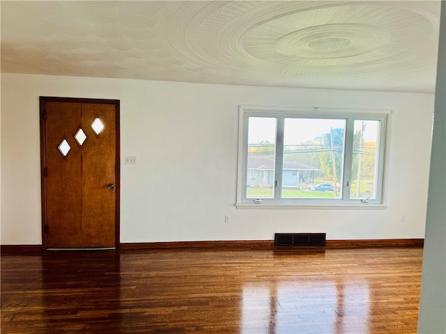 entryway with hardwood / wood-style floors