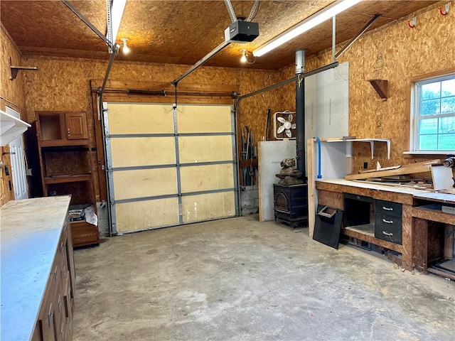 garage featuring a garage door opener and a workshop area