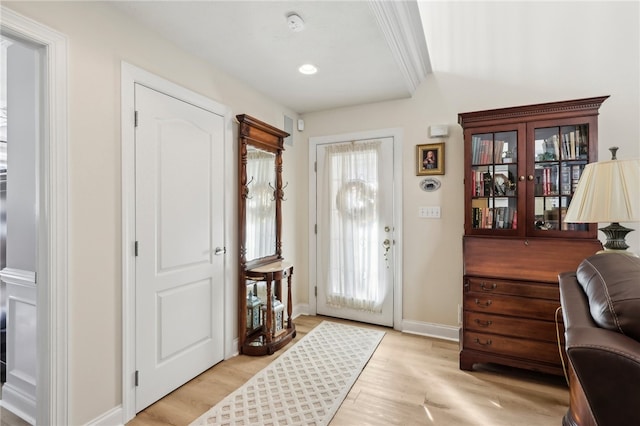 foyer entrance with light hardwood / wood-style flooring