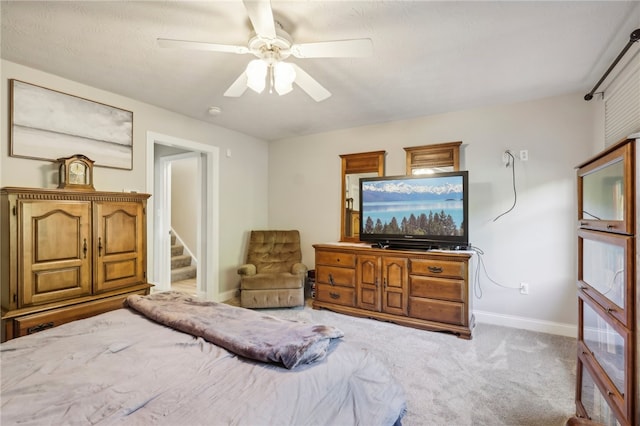 bedroom with light colored carpet and ceiling fan