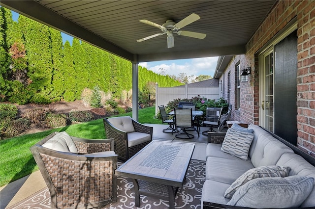 view of patio featuring an outdoor living space and ceiling fan