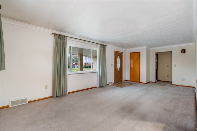 carpeted spare room with crown molding