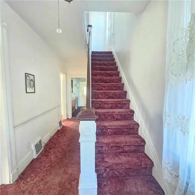 stairs with carpet floors