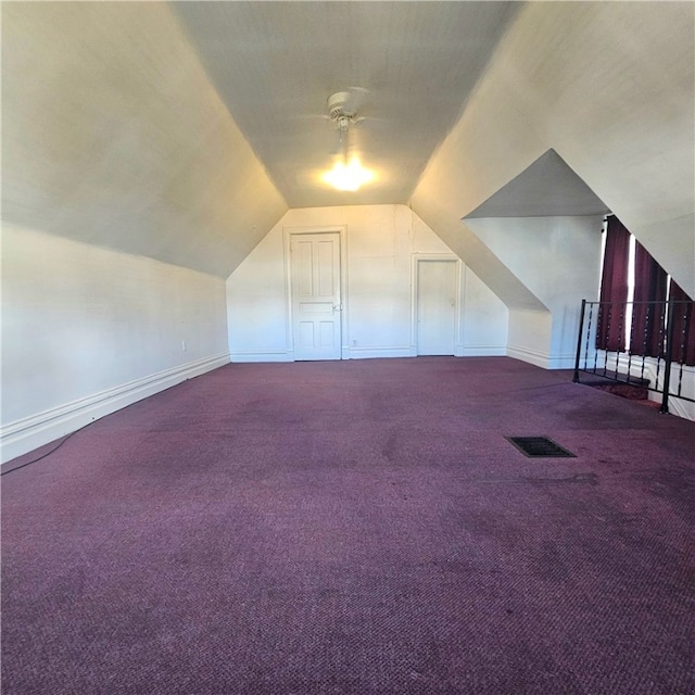 bonus room with carpet, vaulted ceiling, and ceiling fan