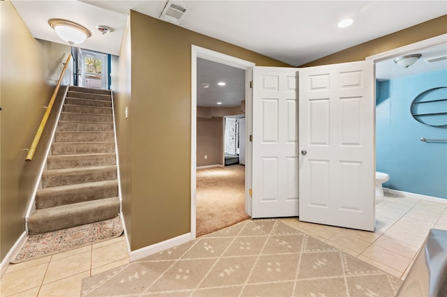 stairway featuring tile patterned floors