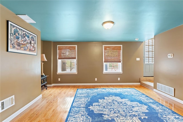 spare room with light hardwood / wood-style floors