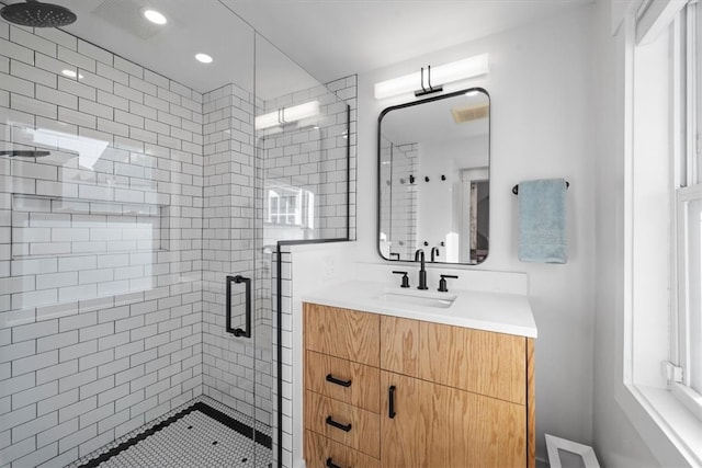 bathroom with vanity and an enclosed shower