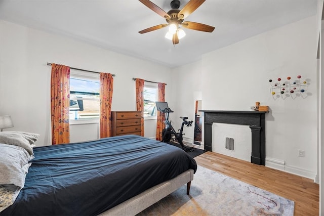 bedroom featuring hardwood / wood-style floors and ceiling fan