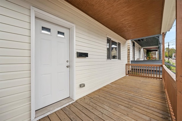 wooden deck featuring covered porch