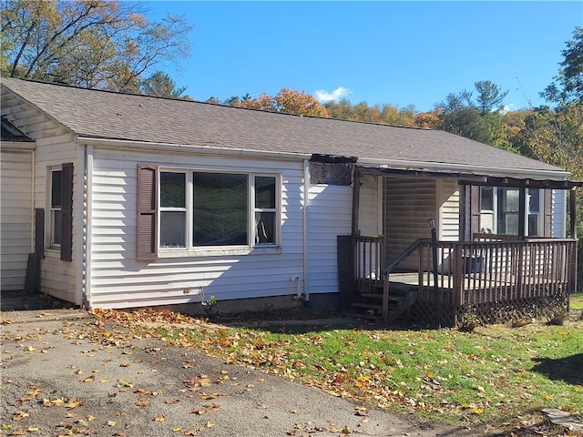 view of front of home featuring a wooden deck