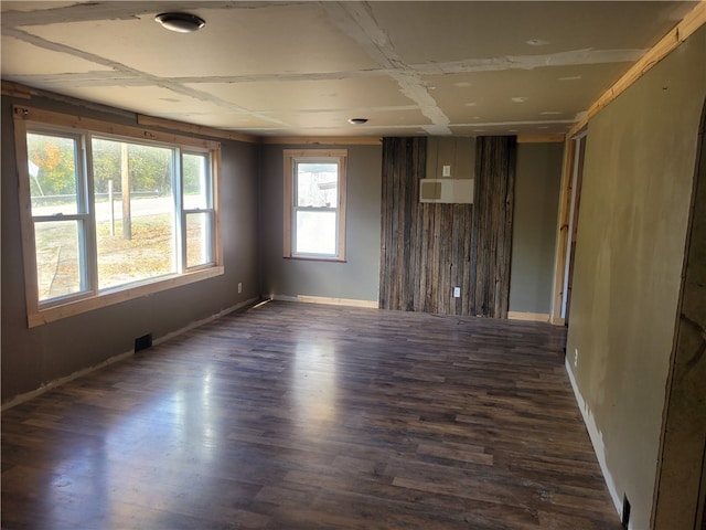 unfurnished room featuring dark wood-type flooring