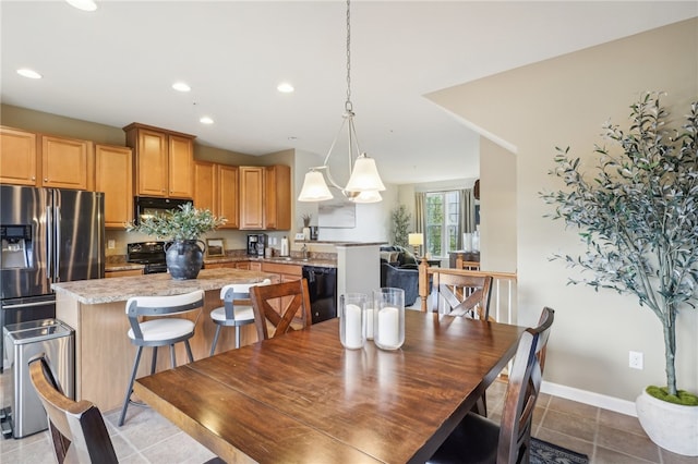 dining area featuring light tile patterned flooring