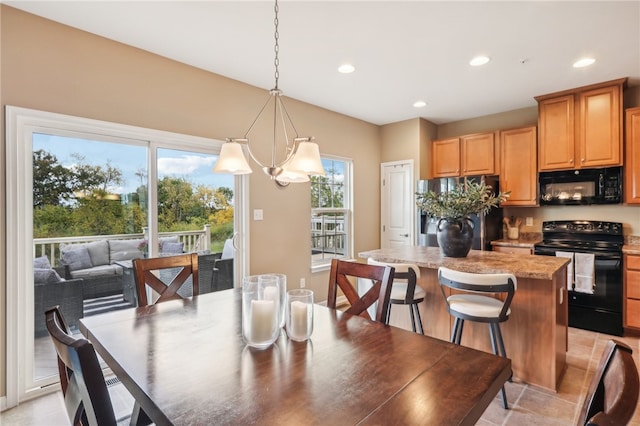 dining space with an inviting chandelier and plenty of natural light