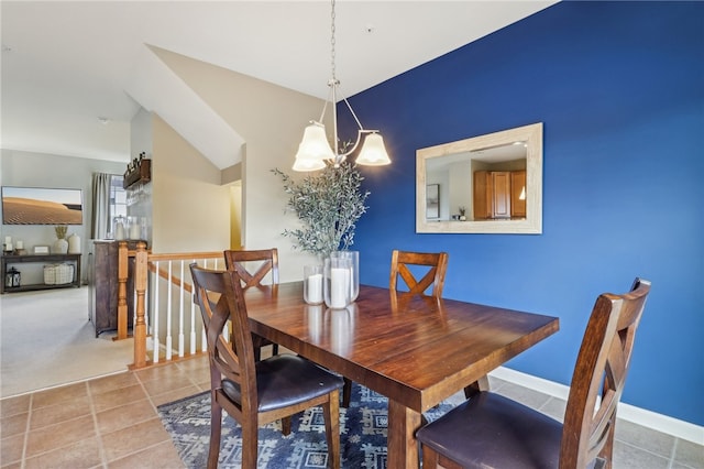 tiled dining space with a notable chandelier