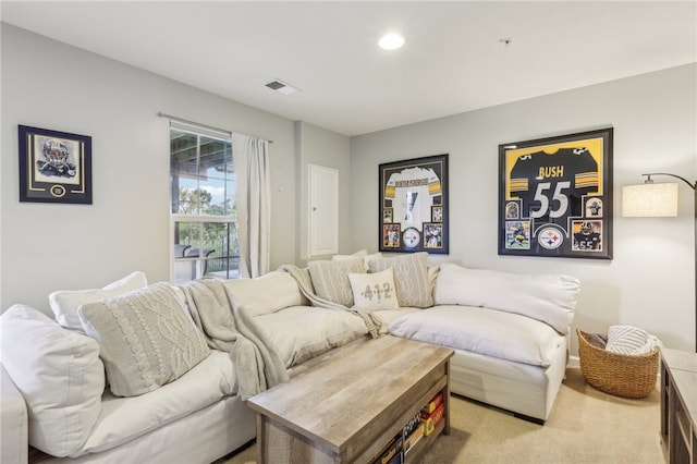 living room with light colored carpet