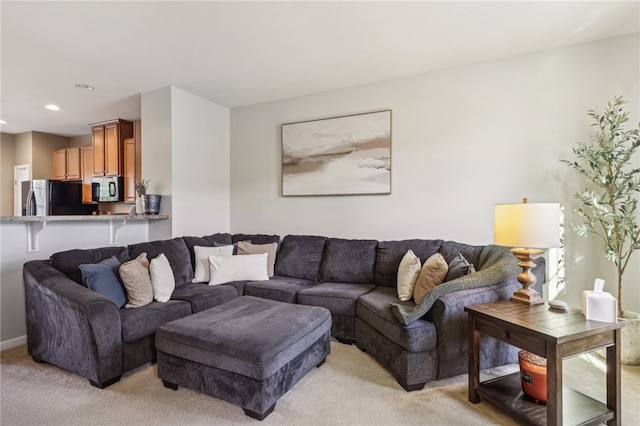 living room featuring light carpet