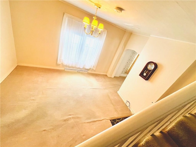 unfurnished dining area with a chandelier and carpet floors