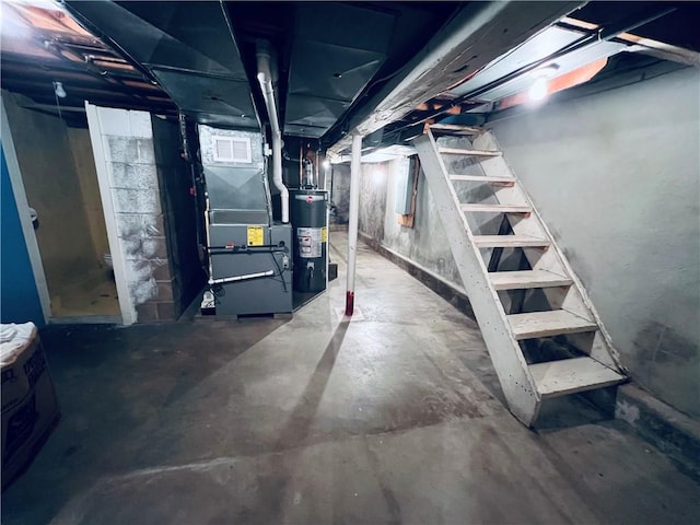 basement featuring heating unit and water heater