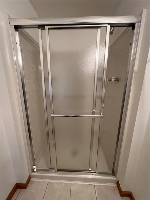 bathroom featuring tile patterned floors and walk in shower