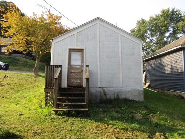 view of outdoor structure featuring a lawn