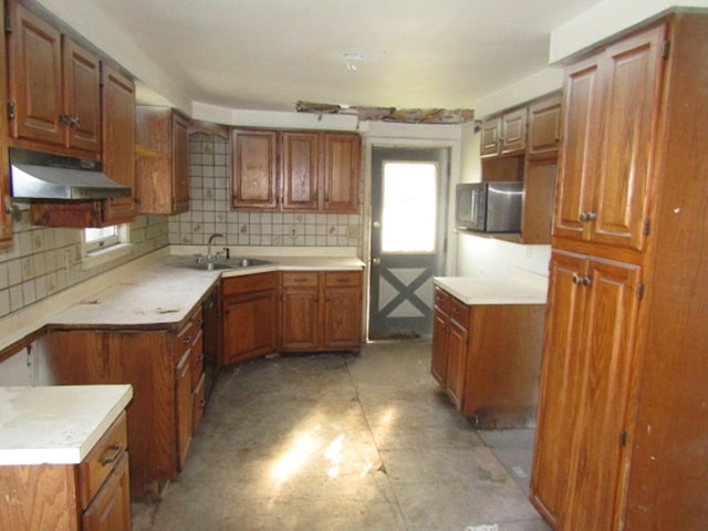 kitchen featuring decorative backsplash and sink