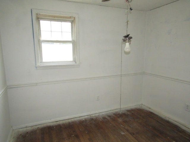 unfurnished room with dark hardwood / wood-style floors