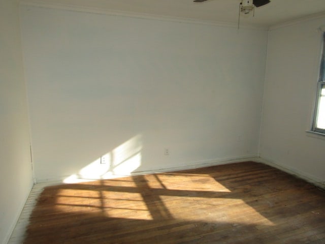 unfurnished room featuring ornamental molding, dark hardwood / wood-style floors, and ceiling fan