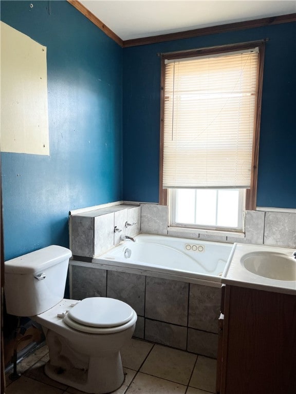 bathroom with vanity, tiled tub, toilet, and tile patterned floors