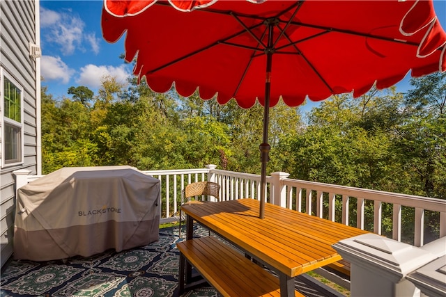 wooden terrace featuring grilling area