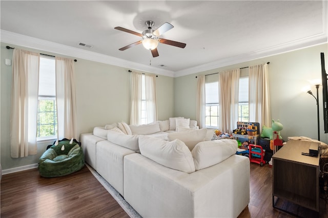 living room with ornamental molding, dark hardwood / wood-style floors, and ceiling fan