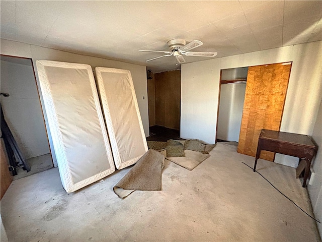 bedroom with concrete flooring and ceiling fan