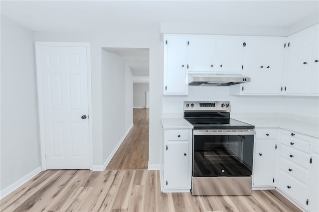 kitchen featuring white cabinetry, light wood-type flooring, and electric stove