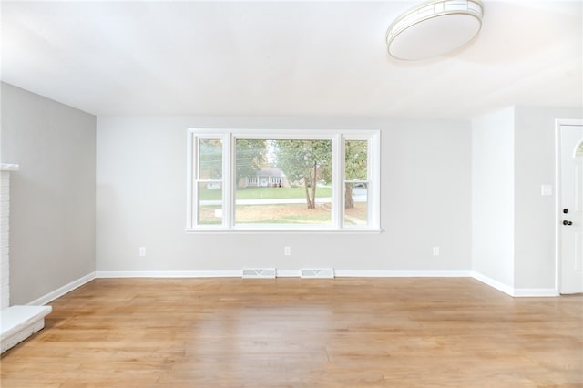 unfurnished living room featuring light hardwood / wood-style floors