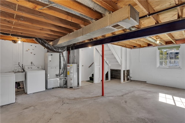 basement with water heater, heating unit, and washer / clothes dryer